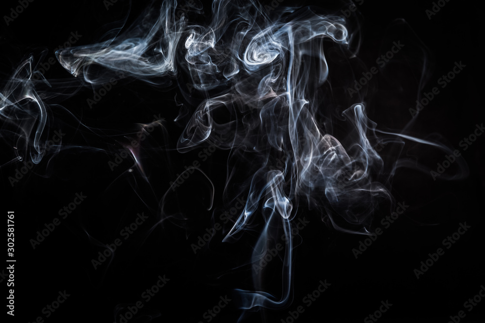 Fototapeta premium Abstract smoke swirls on black