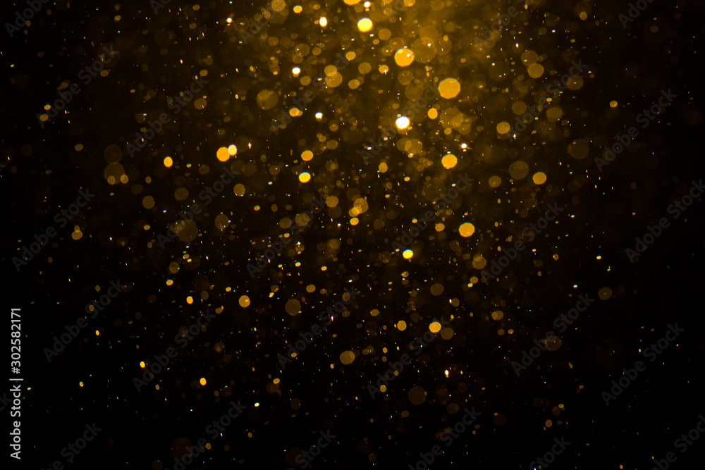 Abstract gold bokeh with black - obrazy, fototapety, plakaty 