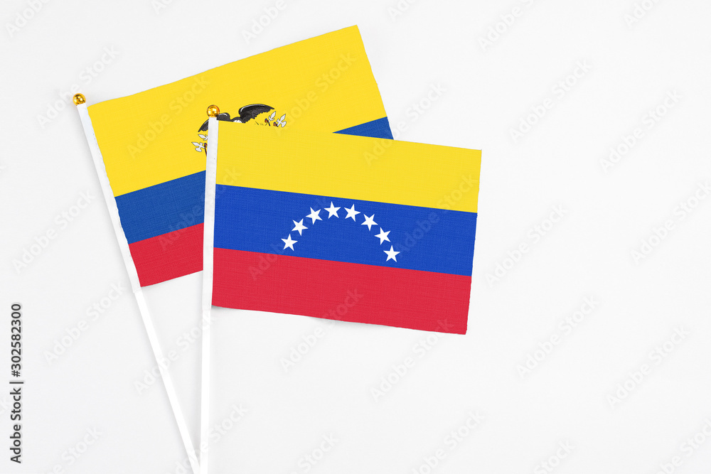Venezuela and Ecuador stick flags on white background. High quality fabric, miniature national flag. Peaceful global concept.White floor for copy space. Venezuela and Ecuador stick flags on white background. High quality fabric, miniature national flag. Peaceful global concept.White floor for copy space.