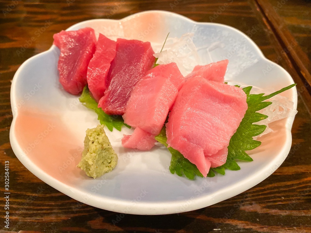 Fresh Tuna fish slice serve with wasabi on the table