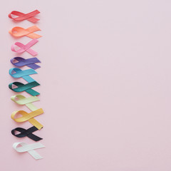 colorful ribbons on pink background, cancer awareness, World cancer day