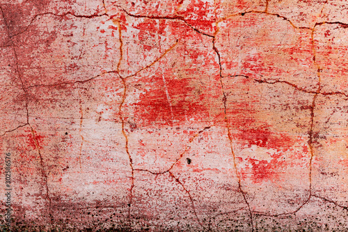 Texture of a concrete wall with cracks and scratches which can be used as a background © chernikovatv