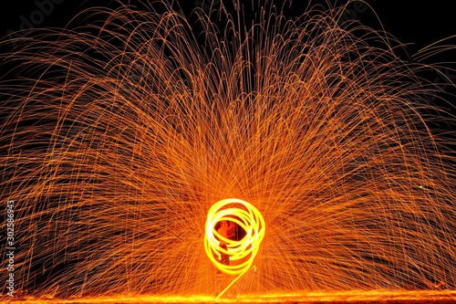 Steel wool fire spinning on the beach.