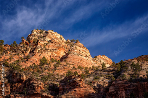 Layered mountain against a blue sky in Zion National Park, Utah