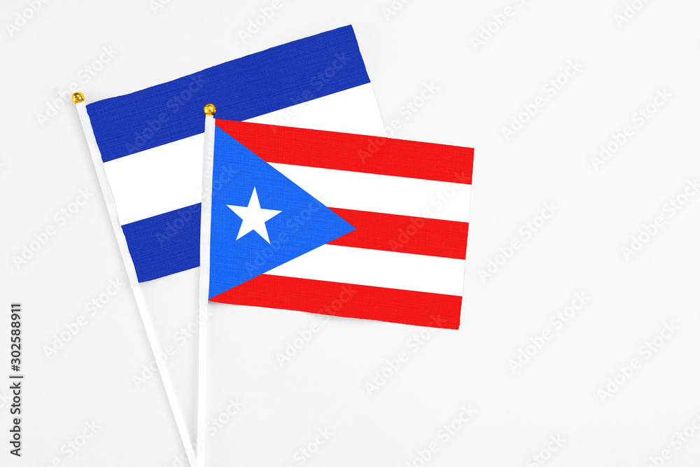 Puerto Rico and El Salvador stick flags on white background. High quality fabric, miniature national flag. Peaceful global concept.White floor for copy space. Puerto Rico and El Salvador stick flags on white background. High quality fabric, miniature national flag. Peaceful global concept.White floor for copy space.