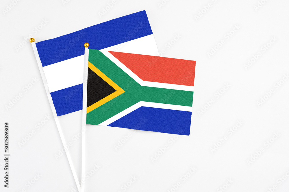 South Africa and El Salvador stick flags on white background. High quality fabric, miniature national flag. Peaceful global concept.White floor for copy space. South Africa and El Salvador stick flags on white background. High quality fabric, miniature national flag. Peaceful global concept.White floor for copy space.