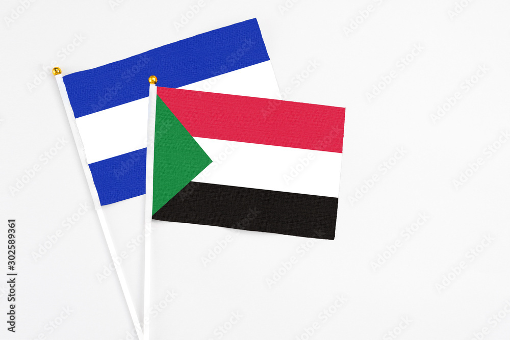 Sudan and El Salvador stick flags on white background. High quality fabric, miniature national flag. Peaceful global concept.White floor for copy space. Sudan and El Salvador stick flags on white background. High quality fabric, miniature national flag. Peaceful global concept.White floor for copy space.