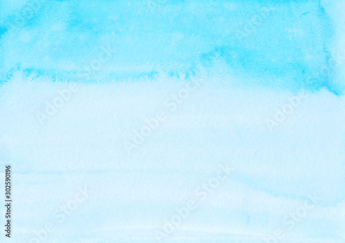 Watercolor light blue and white background texture. Watercolour sky blue ombre backdrop. Stains on paper.