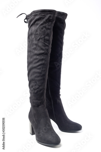 women's black leather high heeled boots isolated on white background