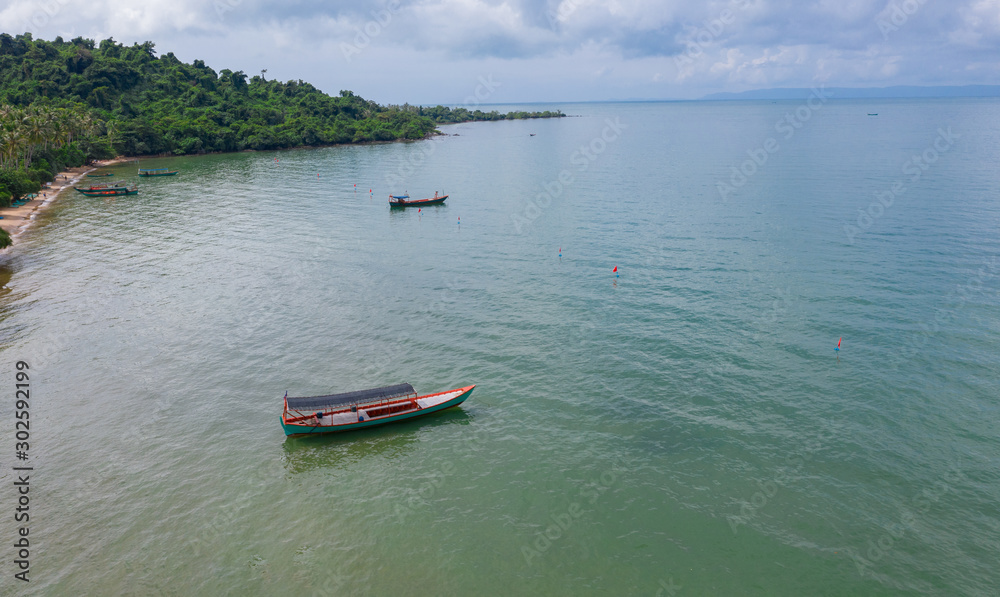 Tropical beach with boats on Koh Tonsay island, Cambodia