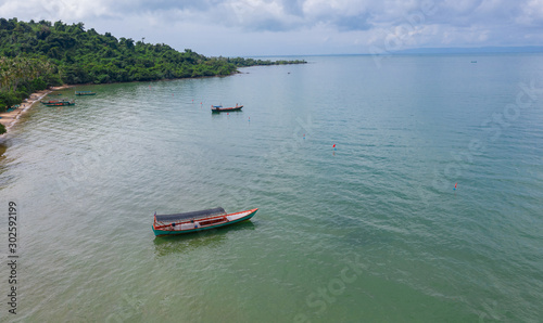 Tropical beach with boats on Koh Tonsay island, Cambodia © Nhut