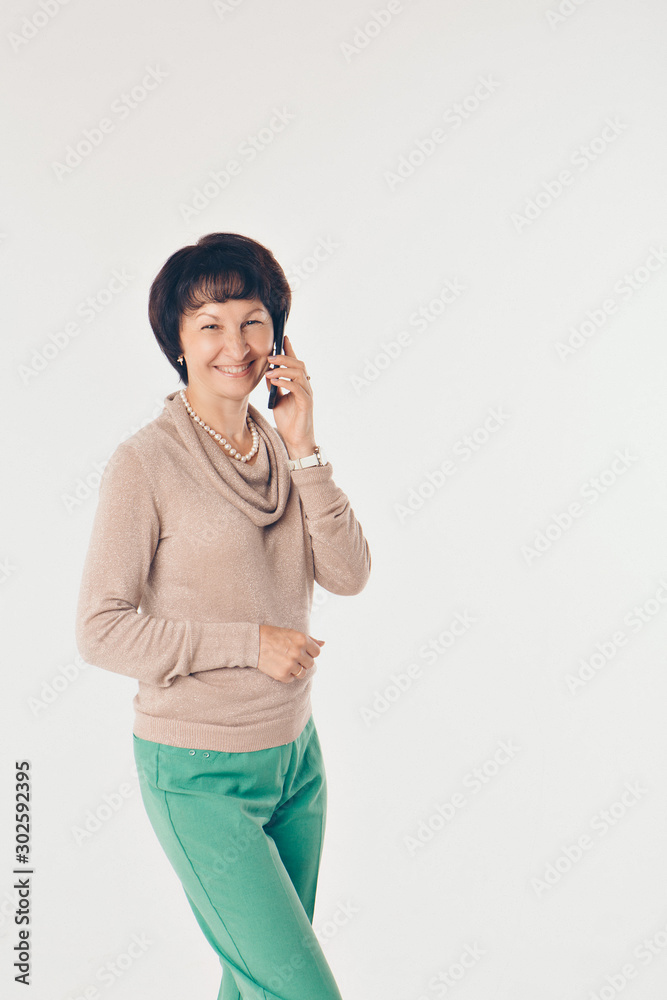 office concept, business plan, fashion-woman talking on the phone. Beautiful woman on white background office concept, business plan, fashion-woman talking on the phone. Beautiful woman on white background