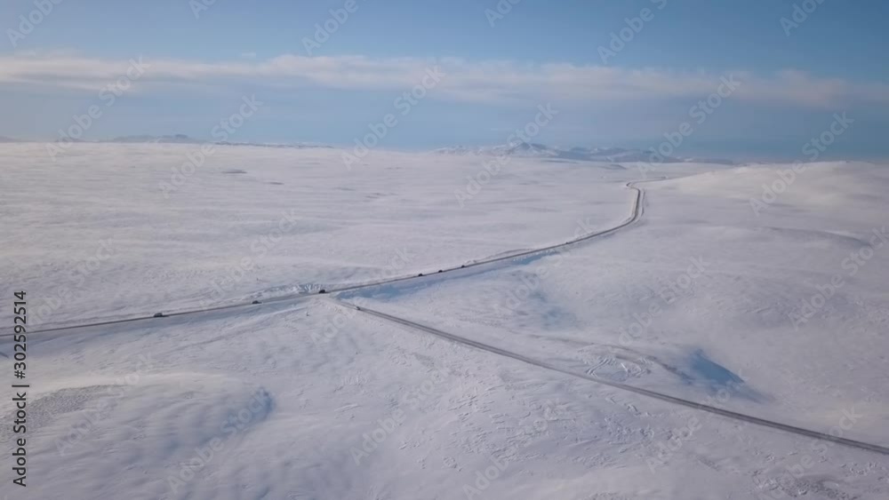 Aerial Drone Above Snow Covered Iceland WIth Cars Driving On Highway 2 Aerial Drone Above Snow Covered Iceland WIth Cars Driving On Highway 2