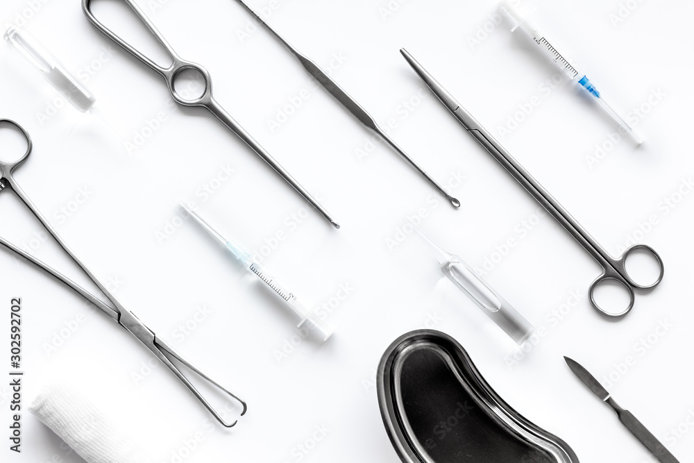 Instruments for plastic surgery on white background top view flat lay pattern Instruments for plastic surgery on white background top view flat lay pattern