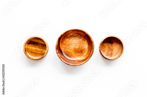 Making wooden dishes. Empty bowls on white background top view copy space