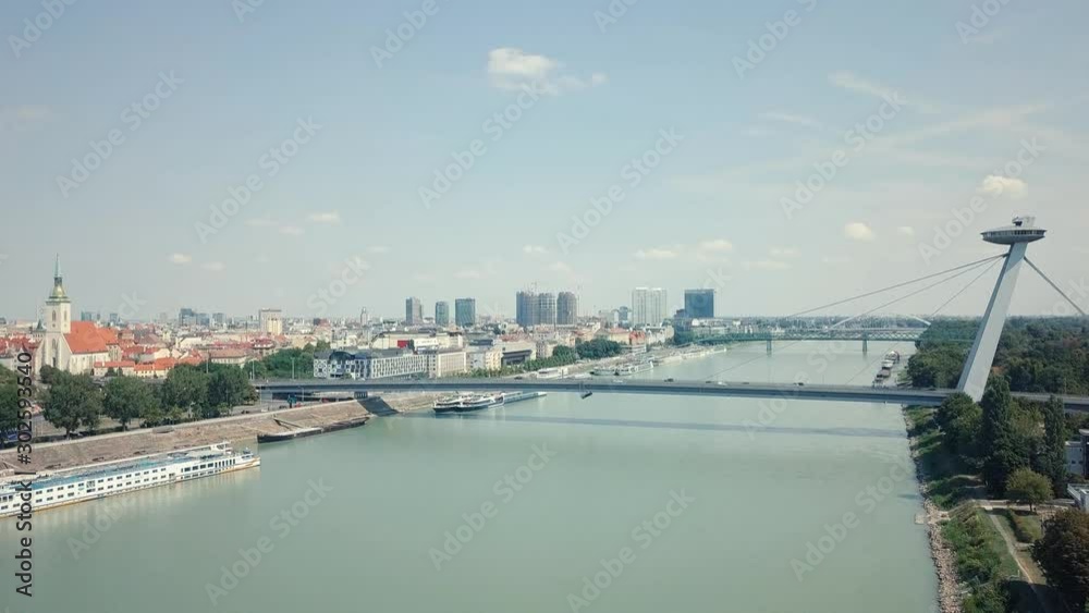 Rising drone shot of a bridge over Danube river, Bratislava, Slovakia Rising drone shot of a bridge over Danube river, Bratislava, Slovakia