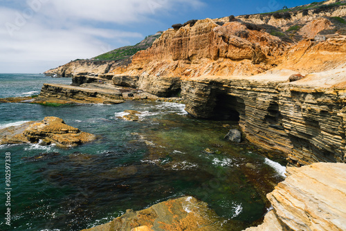 Sandstone cliffs, caves, and ocean view. San Diego Peninsula, California Coastline