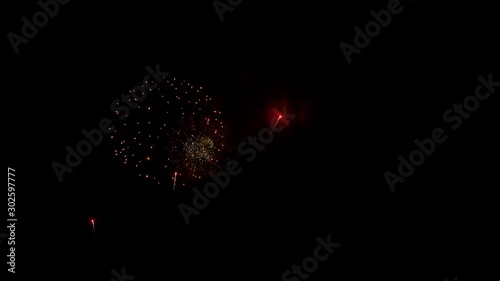 Beautiful colorful holiday fireworks on the black sky background
