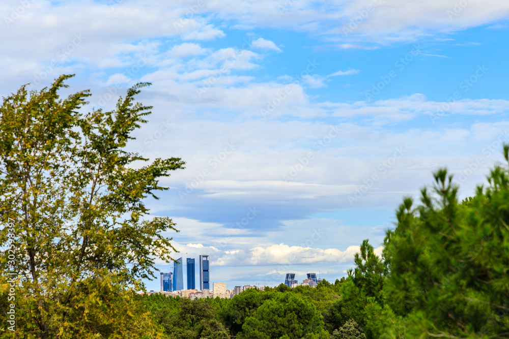 Four business area towers seen from the Casa de Campo park in Madrid Four business area towers seen from the Casa de Campo park in Madrid
