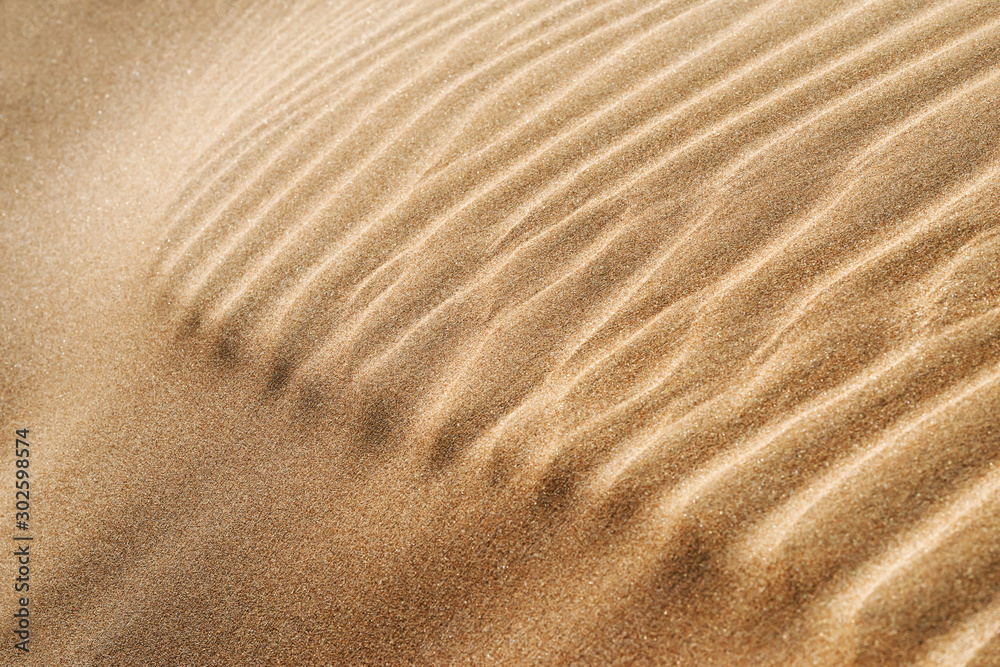 Abstract closeup of desert sand pattern in the Sahara desert of Morocco.  - obrazy, fototapety, plakaty 