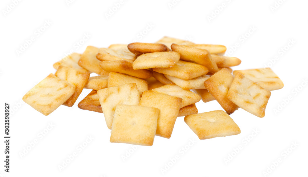 Square mini salted crackers, snack food. Isolated on white.