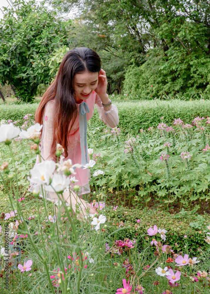 Portrait of beautiful asian woman in the flowers garden Portrait of beautiful asian woman in the flowers garden