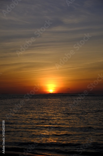 sunset over the sea © Kenta