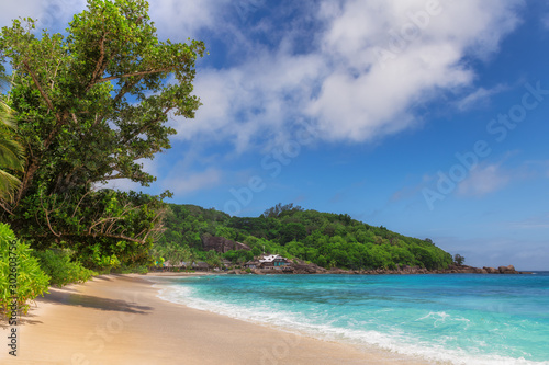 Fototapeta Naklejka Na Ścianę i Meble -  Tropical sunny beach and turquoise sea in Anse Takamaka beach, Seychelles. 