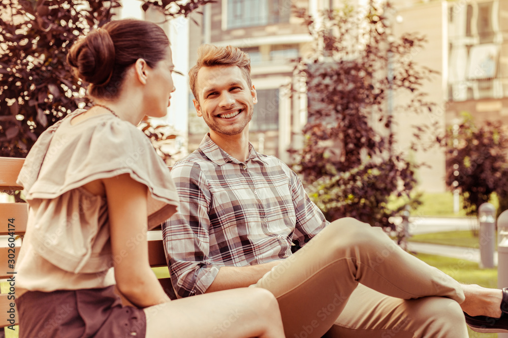 Fototapeta premium Positive delighted young people having pleasant conversation