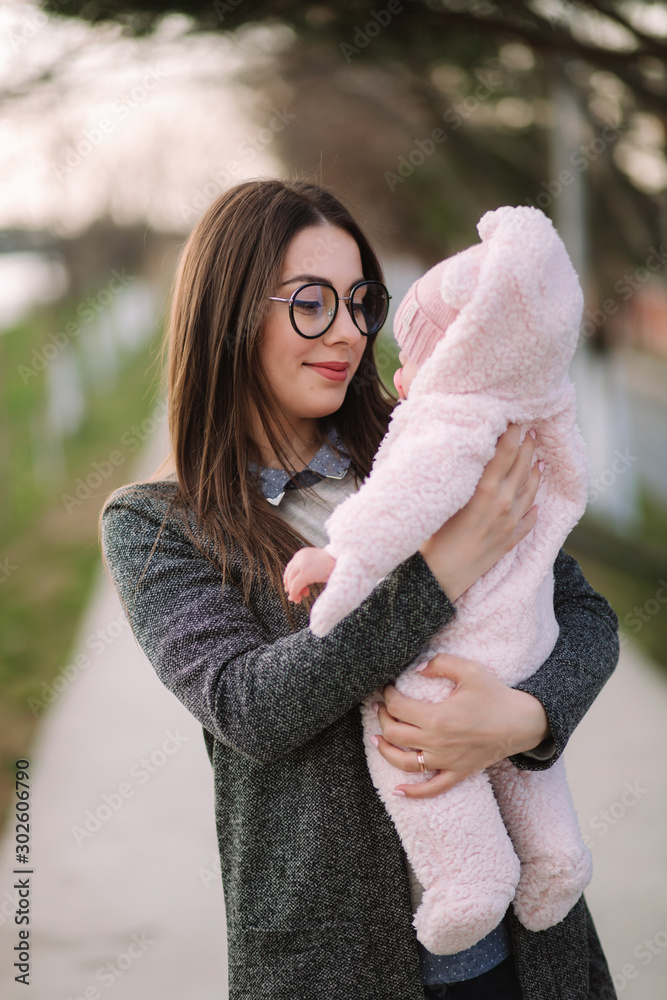 Young mother with her little baby. Mom hold baby on hands. Happy family Young mother with her little baby. Mom hold baby on hands. Happy family