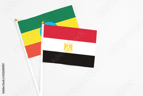 Egypt and Ethiopia stick flags on white background. High quality fabric  miniature national flag. Peaceful global concept.White floor for copy space.