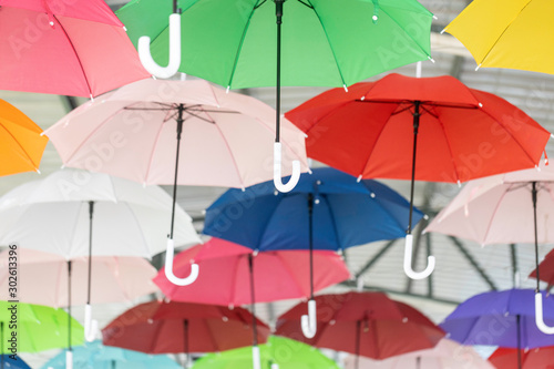 Umbrellas of various colors are hung to decorate the place beautifully.