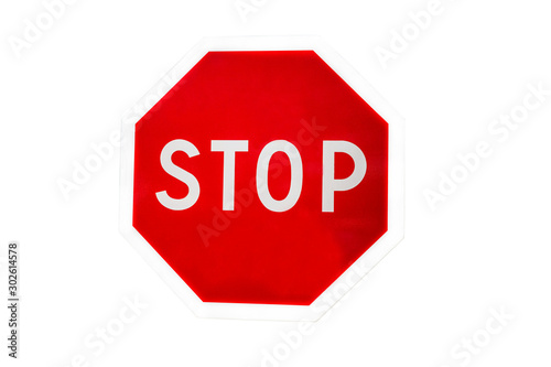 Road sign stop. Close-up. Isolated over white background.