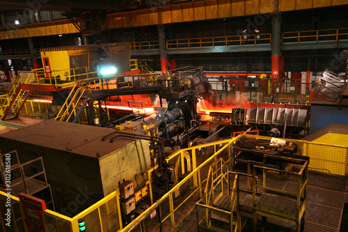 Rolling mill for hot steel in major steelmaking plant. © Paul