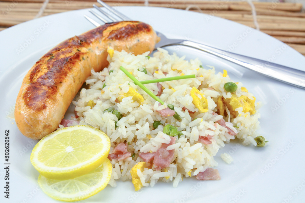 salmon sausage and Cantonese rice on a plate salmon sausage and Cantonese rice on a plate