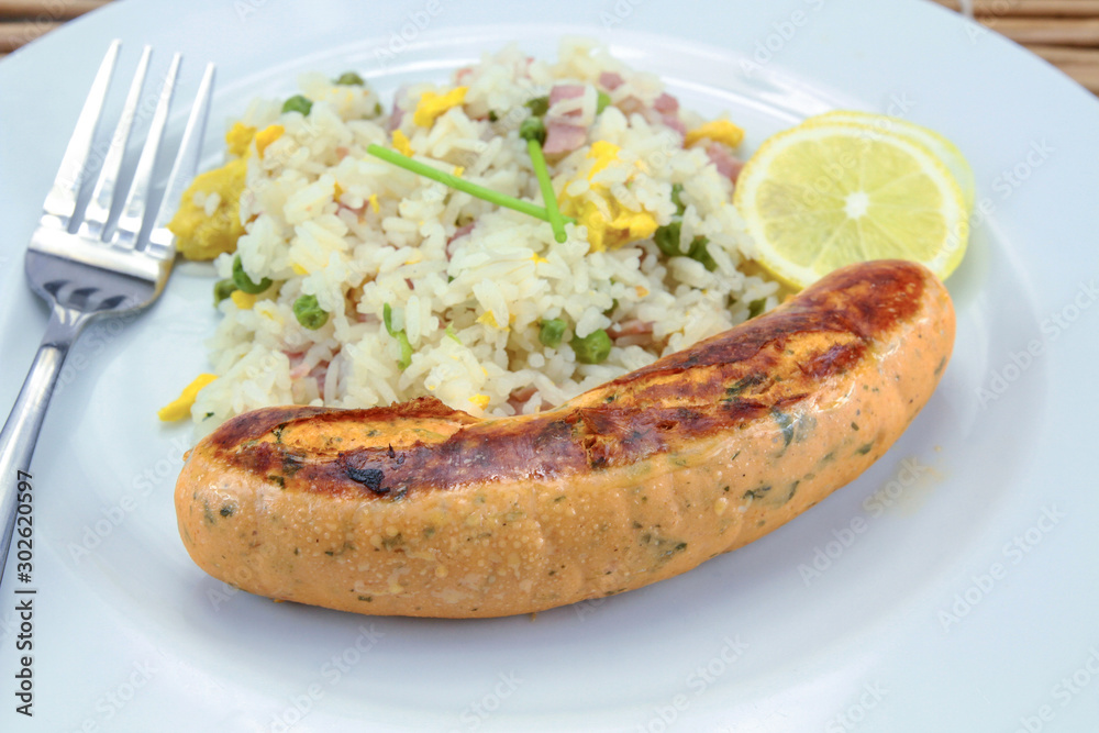 salmon sausage and Cantonese rice on a plate salmon sausage and Cantonese rice on a plate