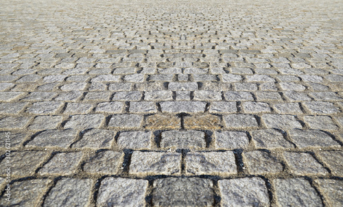 Perspective View Monotone Gray Brick Stone Pavement on The Ground for Street Road. Sidewalk, Driveway, Pavers, Pavement in Vintage Design Ground Flooring Square Pattern Texture Background photo