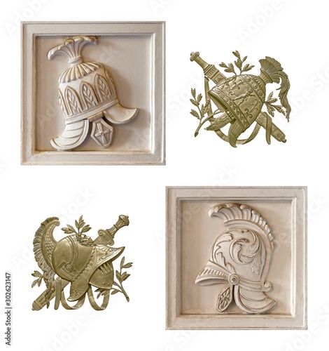 White marble elements and golden elements of the interior with the image of the helmet from the ancient Greek myth. The element is isolated on white background