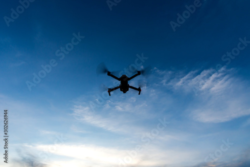 Flying drone and cloud sky