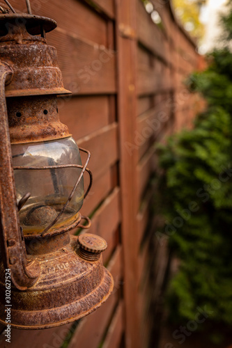 a rusty oil lamp in my garden