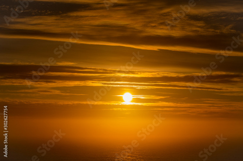 Beautiful and peaceful golden sunset or sunrise over the ocean. © Global News Art