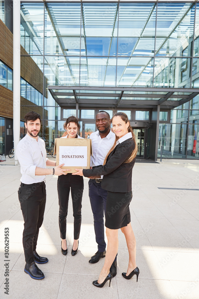 Business people hold donations box