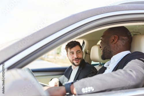 Business people in the car as a carpool photo