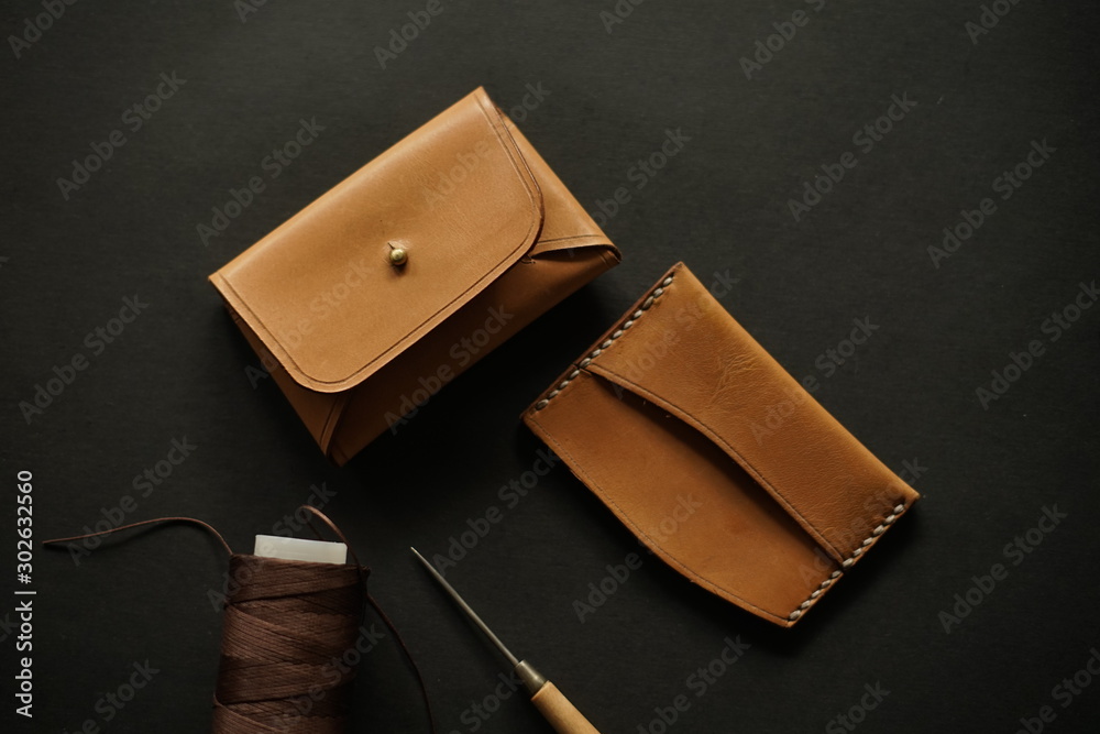 Top view of brown leather wallet, hand made concept. Flatlays imagery Top view of brown leather wallet, hand made concept. Flatlays imagery