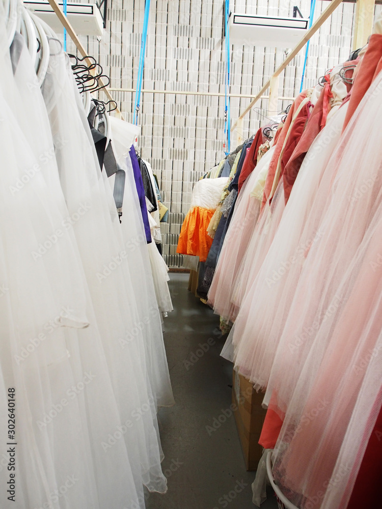 Tulle costumes hanging in wardrobe in theatre company Tulle costumes hanging in wardrobe in theatre company