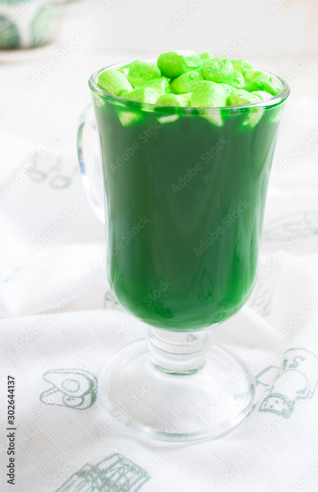green drink with marshmallows in a glass green drink with marshmallows in a glass