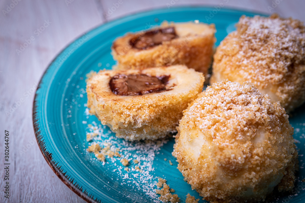 Bread crumb dumplings stuffed with chocolate and nuts