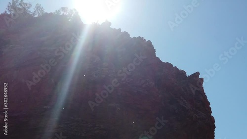 SLOW MOTION: Ellery Creek Big Hole, geological site with hight red cliffs in West MacDonnell National Park, 80km from Alice Springs, Northern Territory, Central Australia. Australian outback. photo