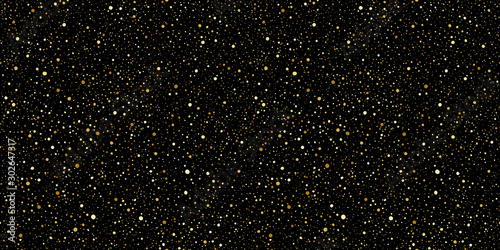 Gold round splash dots or glittering spangles seamless background. Hand drawn spray texture. Golden blobs, sparks, sparkles or glitter on black background endless template. Luxury splatter pattern.
