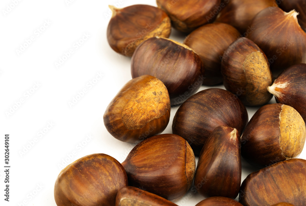 Chestnuts with shell isolated on white background, a pile of fresh chestnuts Chestnuts with shell isolated on white background, a pile of fresh chestnuts